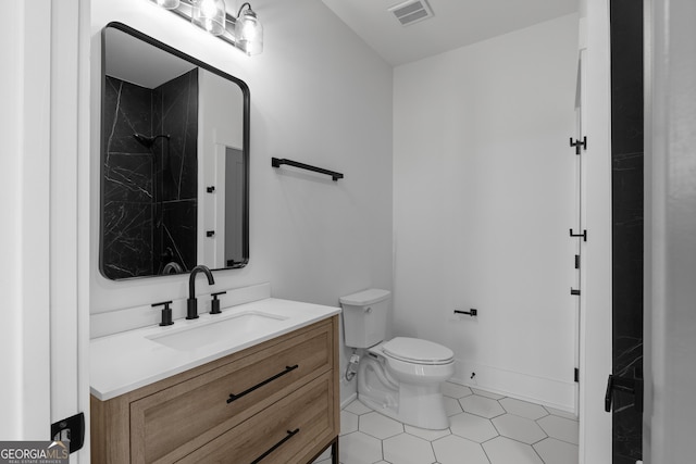 full bath featuring tile patterned floors, visible vents, toilet, vanity, and walk in shower