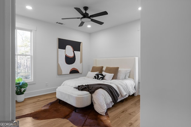 bedroom featuring recessed lighting, baseboards, and wood finished floors