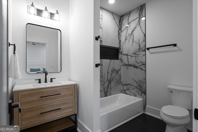 full bathroom featuring tile patterned flooring, toilet, vanity, baseboards, and tub / shower combination