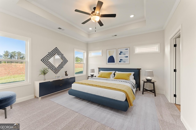 carpeted bedroom with crown molding, recessed lighting, a raised ceiling, visible vents, and baseboards