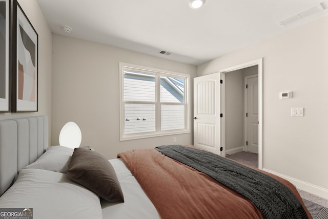 bedroom featuring visible vents, baseboards, and carpet flooring