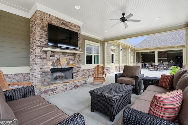 view of patio / terrace featuring an outdoor living space with a fireplace, outdoor dining area, and a ceiling fan