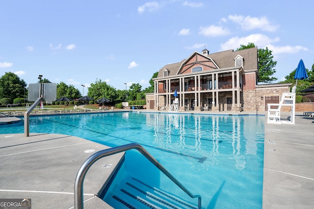 community pool featuring a patio area