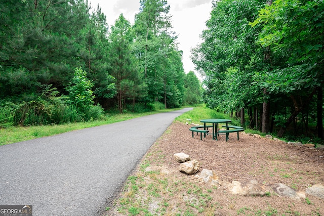 view of property's community with aphalt driveway