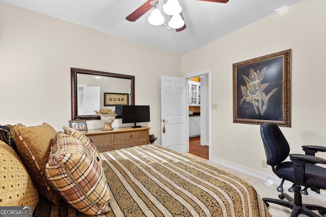 bedroom featuring ceiling fan and baseboards