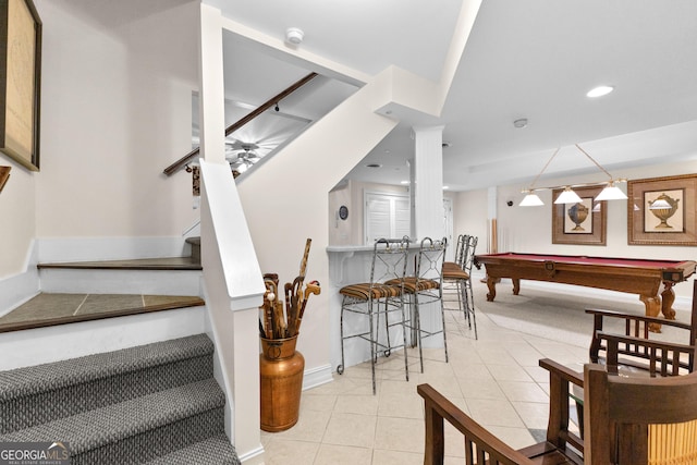 stairway featuring recessed lighting, pool table, baseboards, and tile patterned floors