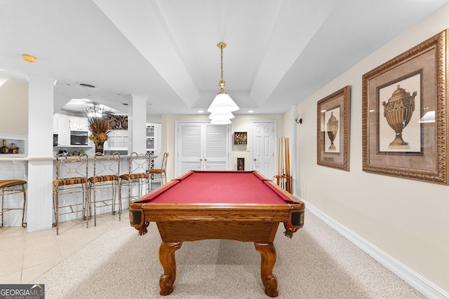 game room with a tray ceiling, billiards, baseboards, and light tile patterned floors