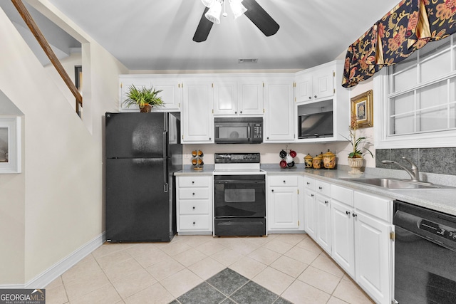 kitchen with light tile patterned floors, a sink, visible vents, white cabinetry, and black appliances