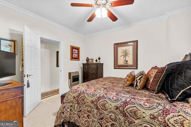 carpeted bedroom with a ceiling fan, crown molding, and heating unit