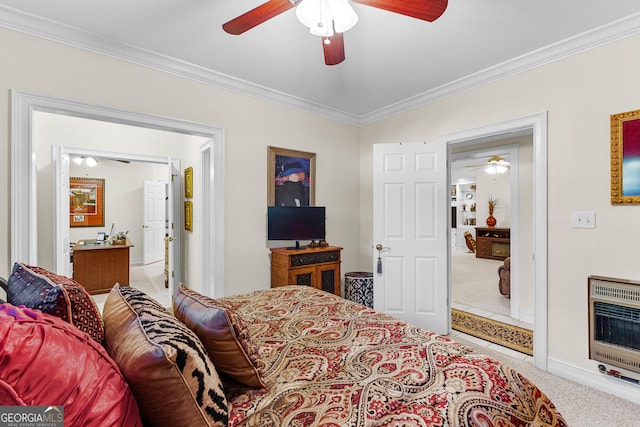 bedroom with ceiling fan, a fireplace, carpet flooring, heating unit, and crown molding