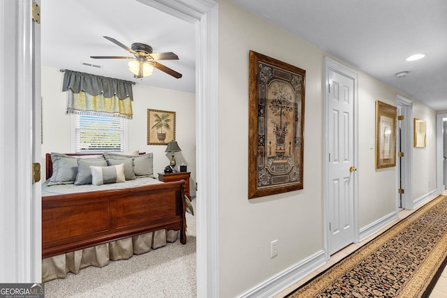 corridor with baseboards, visible vents, and recessed lighting