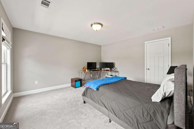 bedroom featuring carpet, visible vents, and baseboards