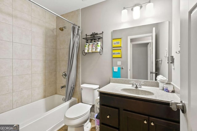 bathroom featuring toilet, shower / bath combo, and vanity