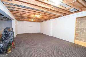 unfinished basement featuring carpet flooring