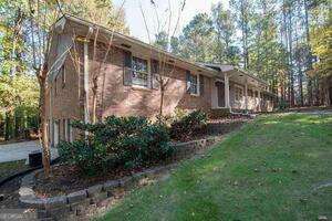 view of side of property with a yard