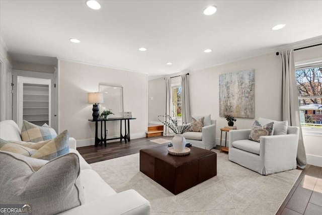 living area with recessed lighting, baseboards, crown molding, and wood finished floors