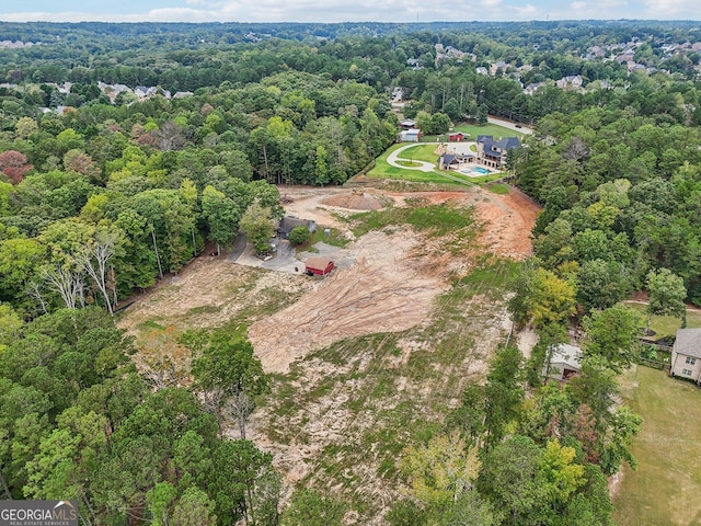 aerial view with a wooded view