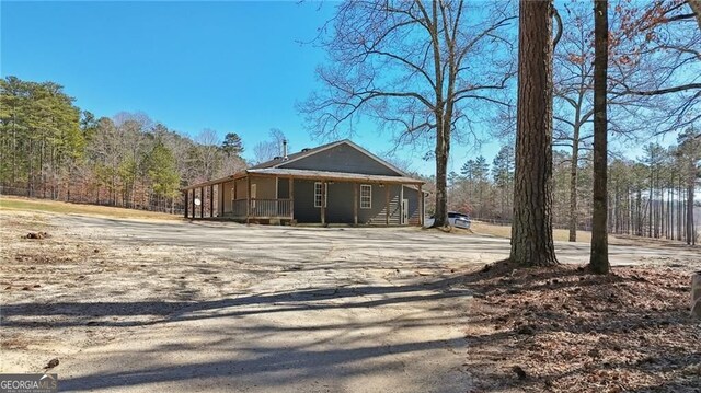 3630 Jim Moore Rd, Dacula, GA 30019 - exterior space with a porch and driveway