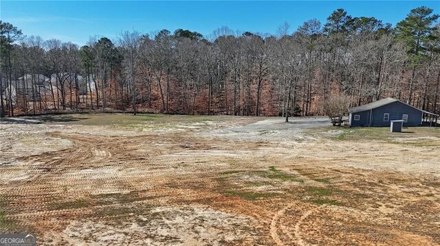3630 Jim Moore Rd, Dacula, GA 30019 - view of yard featuring a wooded view