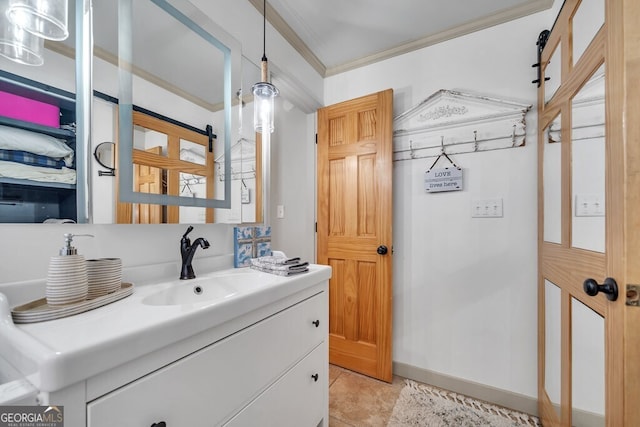 bathroom featuring tile patterned flooring, vanity, and ornamental molding