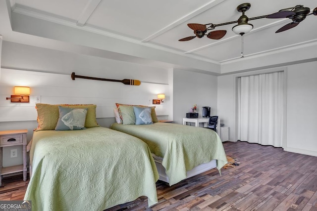 bedroom with crown molding, ceiling fan, and wood finished floors