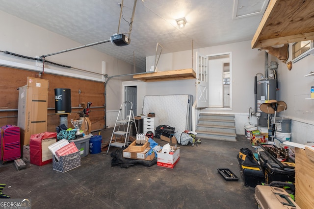 garage featuring a garage door opener and gas water heater