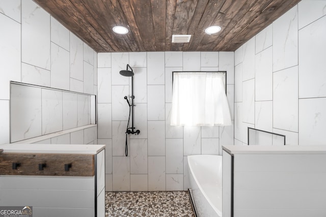 bathroom featuring visible vents, tiled shower, wooden ceiling, tile walls, and recessed lighting