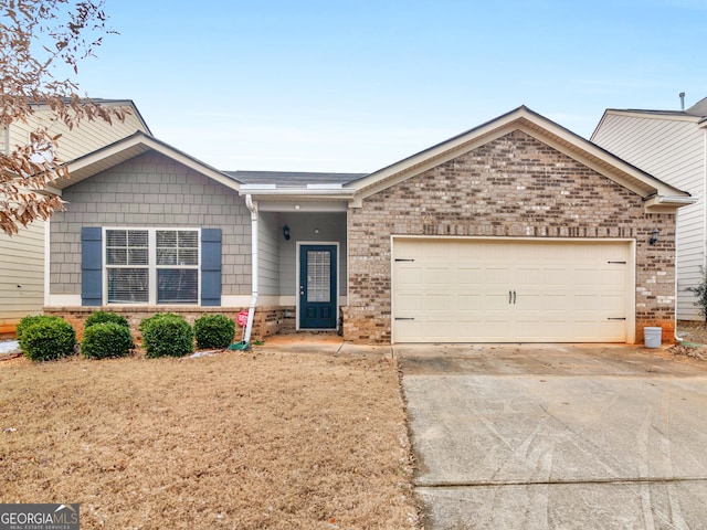 ranch-style house featuring an attached garage, driveway, and brick siding