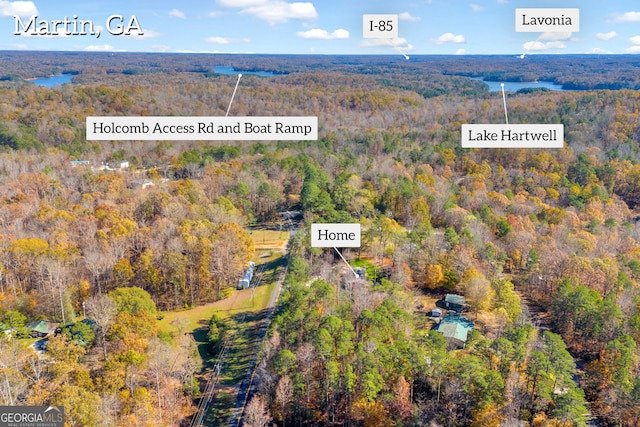 aerial view featuring a forest view