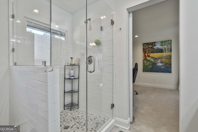 full bath with a stall shower and baseboards