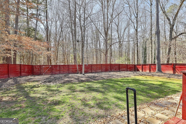 view of yard with fence private yard and a gate