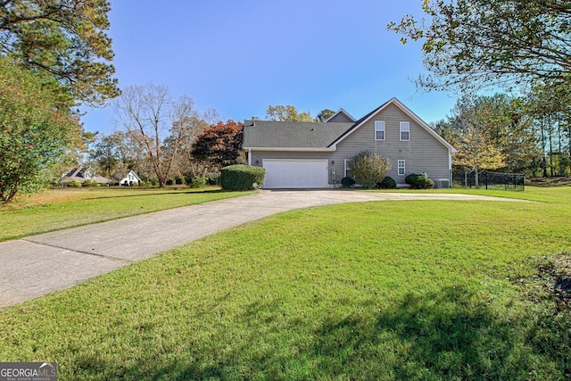 view of front of home with driveway, a garage, and a front lawn