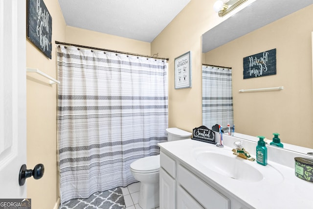 bathroom with toilet, a shower with curtain, tile patterned floors, a textured ceiling, and vanity