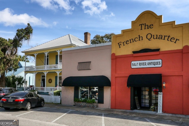 view of property with uncovered parking