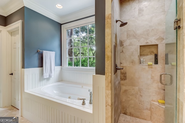 bathroom with a jetted tub, a shower stall, crown molding, and wainscoting