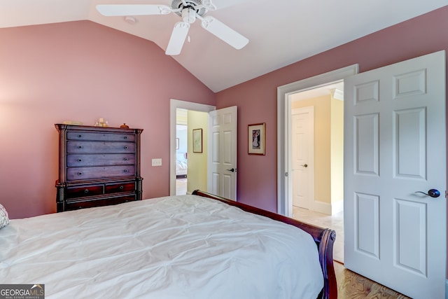 bedroom featuring lofted ceiling and a ceiling fan