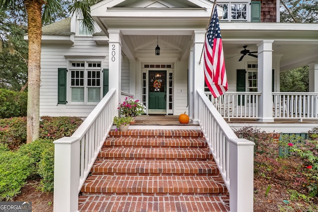 entrance to property featuring covered porch and ceiling fan