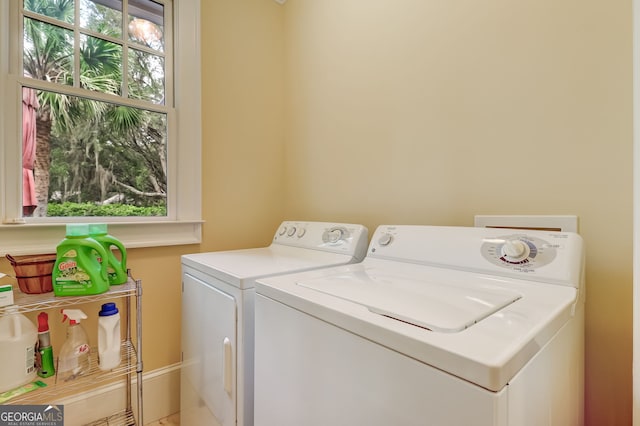 washroom featuring laundry area and separate washer and dryer