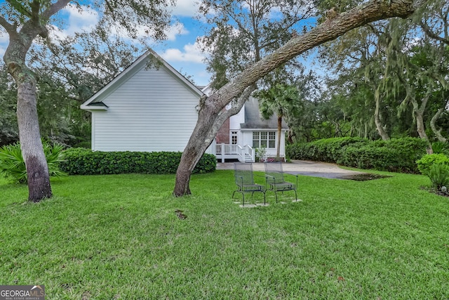 back of house with a yard