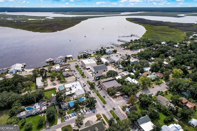 birds eye view of property featuring a water view and a residential view