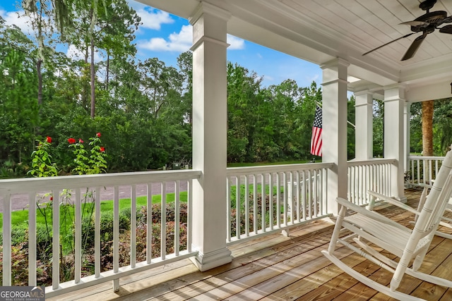 deck featuring ceiling fan and a porch