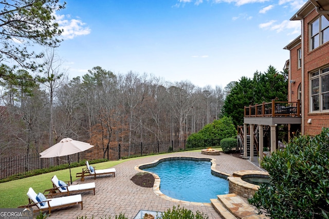 view of swimming pool with a fenced backyard, stairway, and a patio