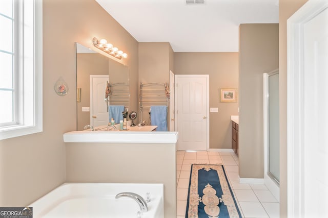 bathroom with tile patterned floors, visible vents, a shower stall, vanity, and a bath