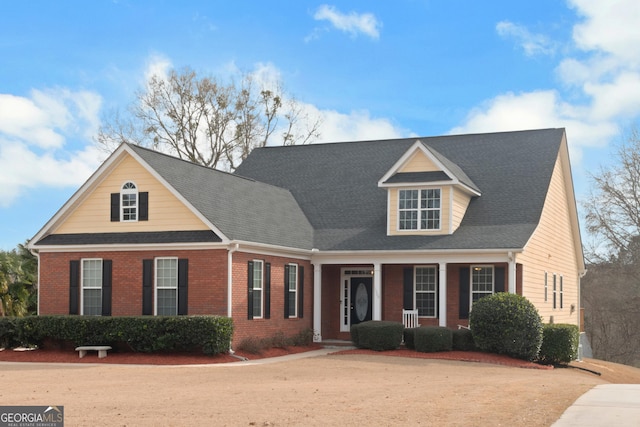 view of front of home featuring brick siding