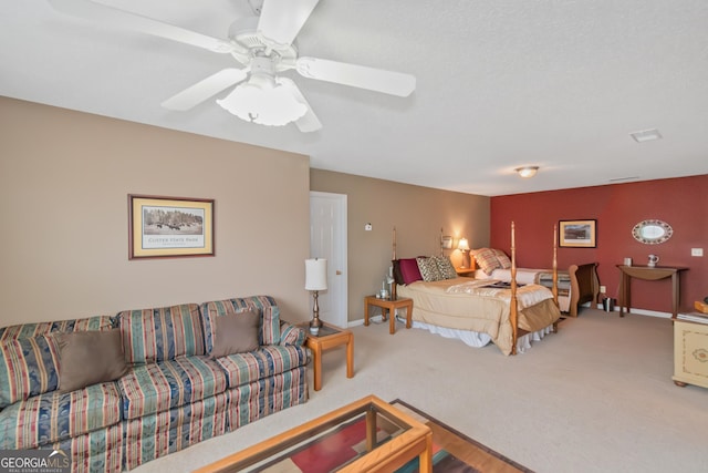 bedroom featuring carpet floors, a ceiling fan, and baseboards