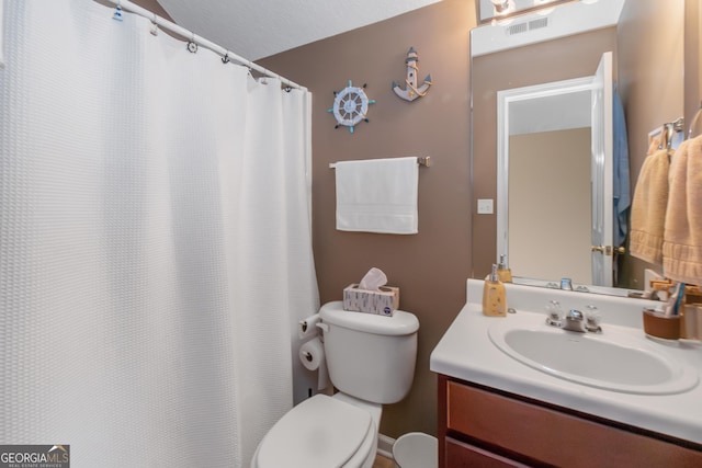 full bathroom featuring toilet, vanity, and visible vents