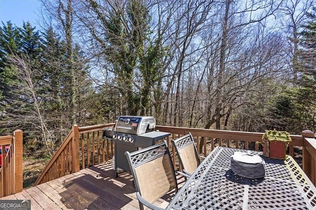 wooden deck with outdoor dining space