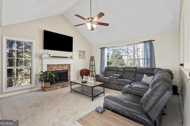 carpeted living area featuring a ceiling fan, a fireplace, and high vaulted ceiling