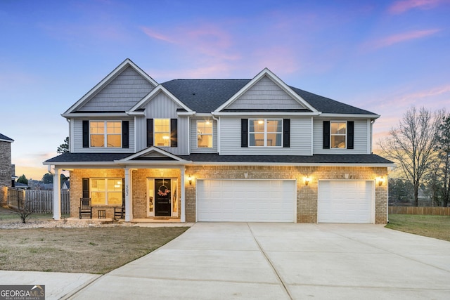 view of front of property with driveway, an attached garage, covered porch, fence, and brick siding