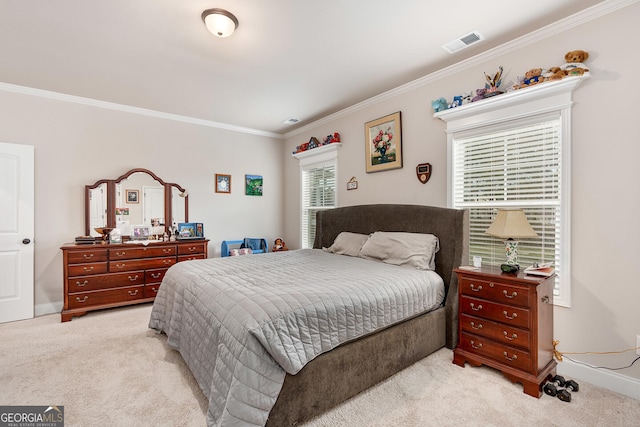 bedroom featuring crown molding, baseboards, visible vents, and light colored carpet